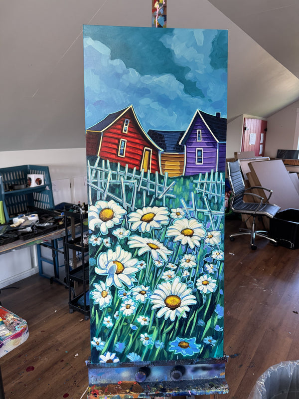 The original painting Daisies by Adam Young on the easel in the artist's Newfoundland studio