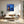 Load image into Gallery viewer, Little Outhouse by Adam Young hung in a bright living room
