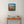 Load image into Gallery viewer, Patch of Poppies by Adam Young above a console table in a hallway
