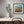 Load image into Gallery viewer, Patch of Poppies by Adam Young framed above a desk
