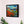Load image into Gallery viewer, Patch of Poppies by Adam Young framed on a white wall above a sideboard
