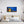 Load image into Gallery viewer, Bright Little Town canvas shown in a room setting
